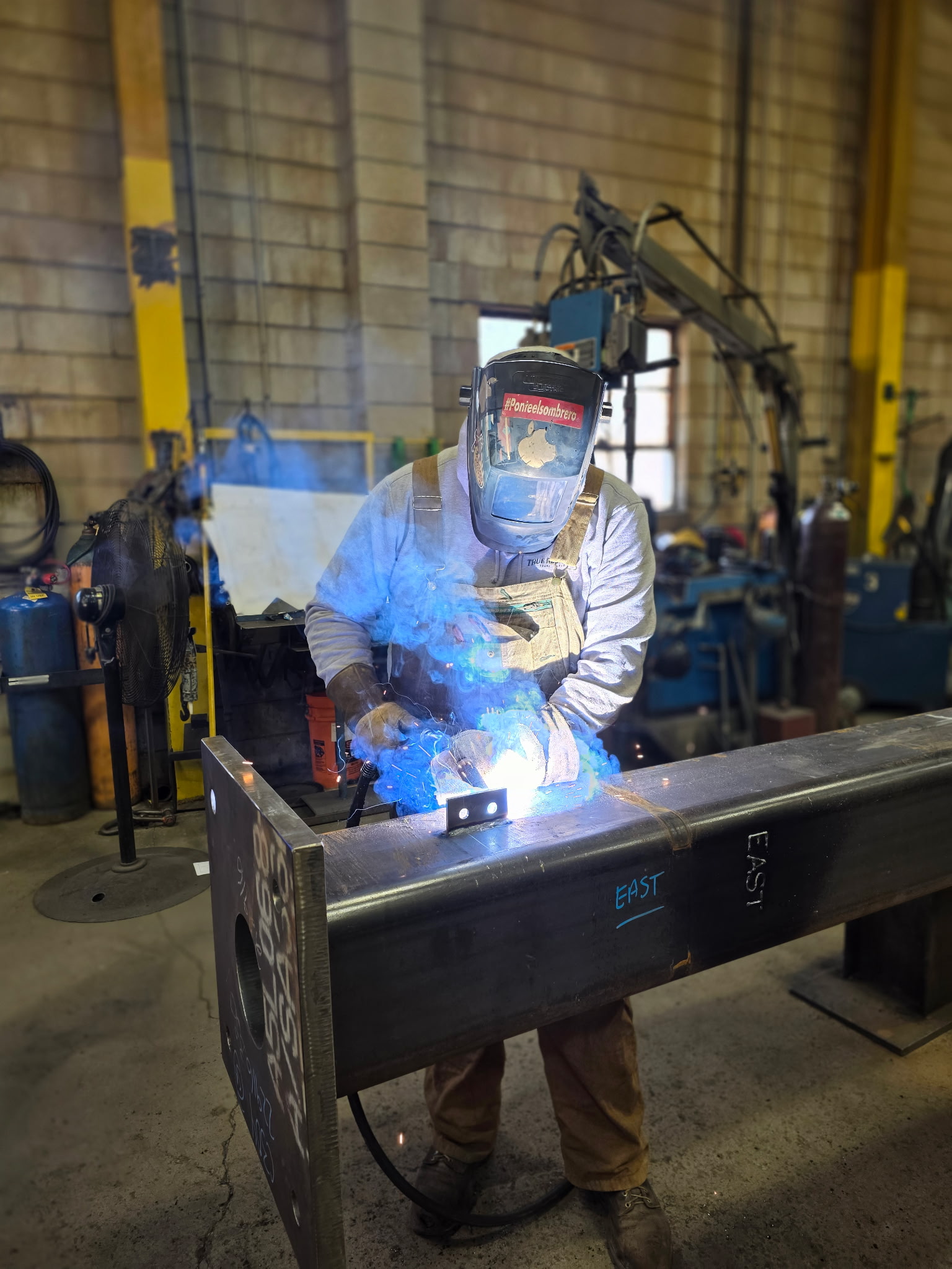 Lockport-steel-metal-worker A metal worker fabricating structural steel in a lockport Steel production facility.